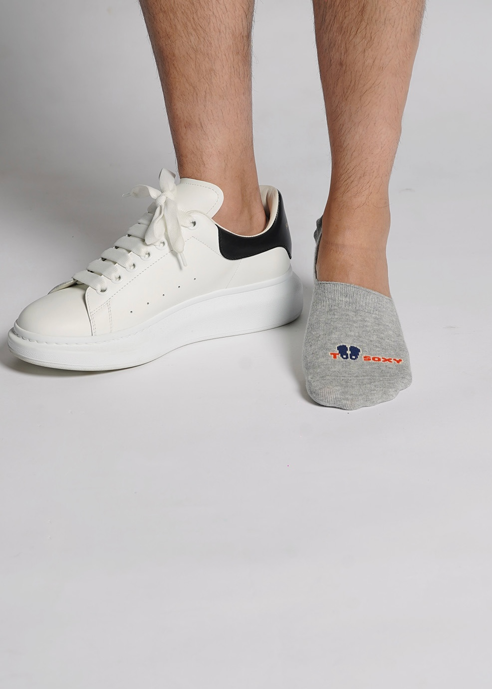 Grey Too Soxy No Show Sock worn with a white sneaker